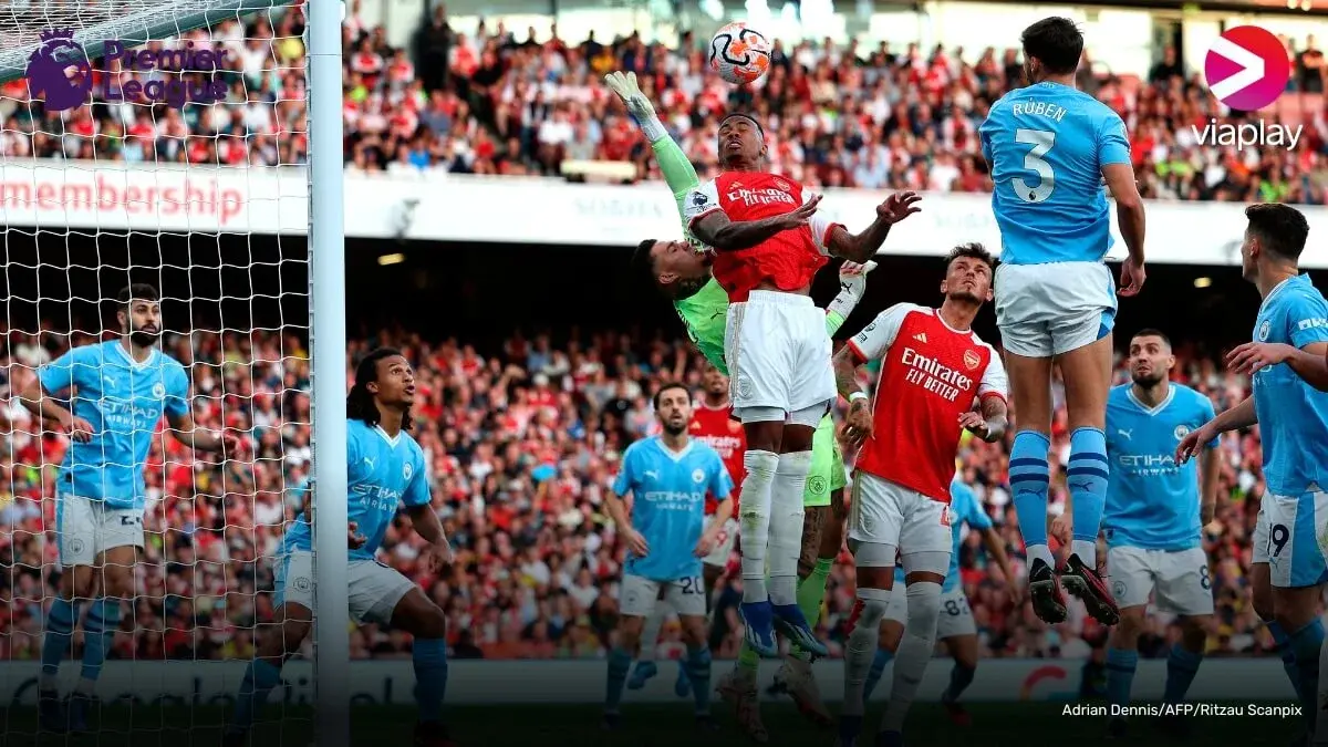 Premier League player kicking a ball enthuasiastically.